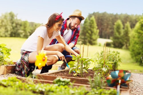 Professional gardener carrying out scheduled maintenance